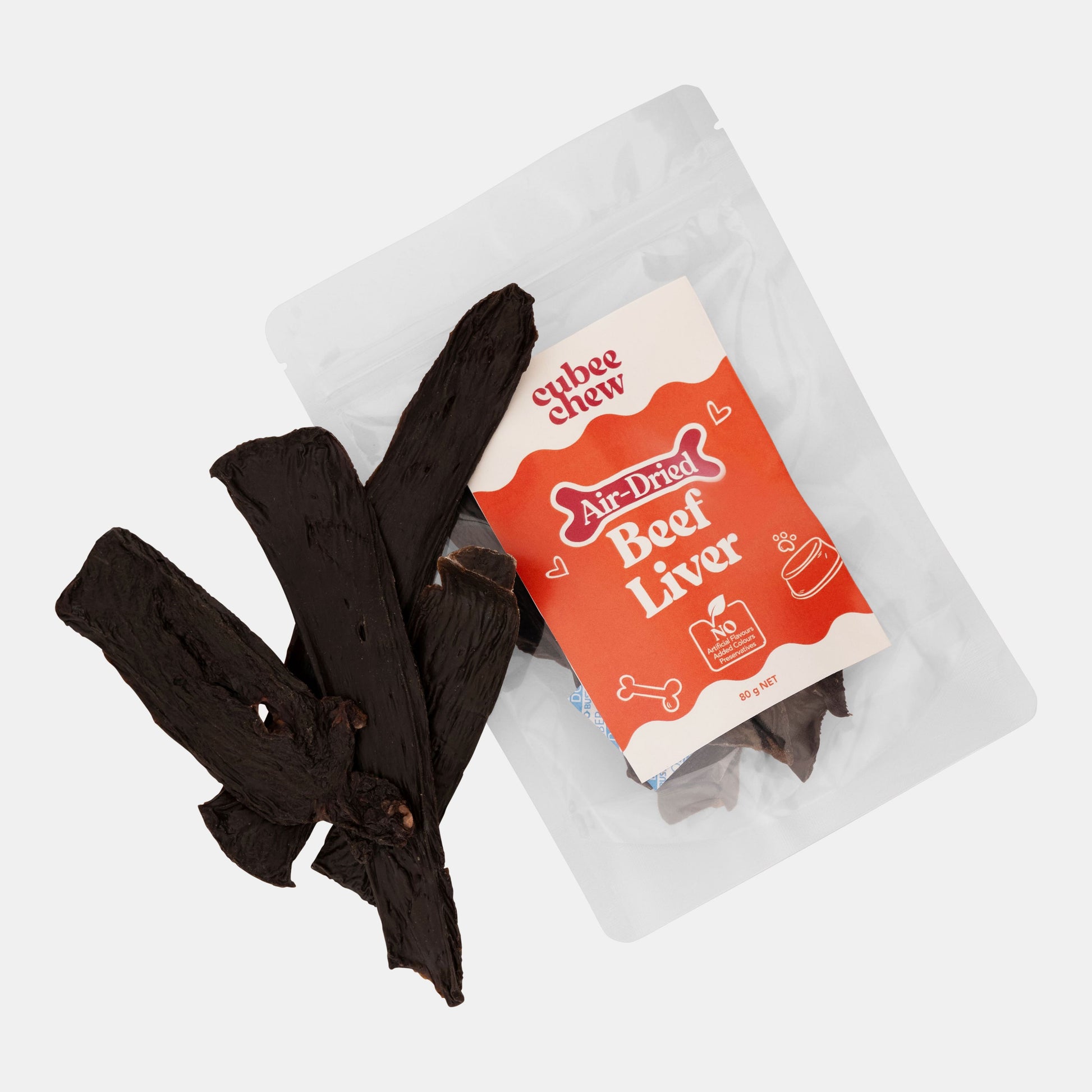 Air-dried beef liver treat packaging with a few pieces on a white background