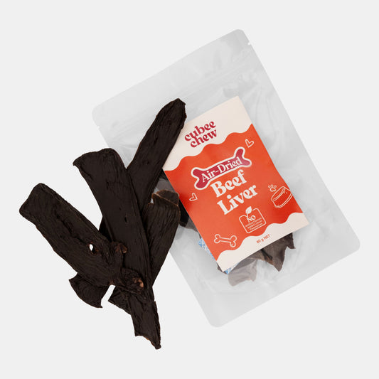 Air-dried beef liver treat packaging with a few pieces on a white background